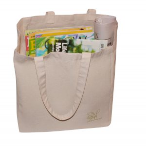 canvas tote bag filled with books and magazines