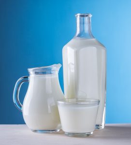 fresh cold milk on a blue background