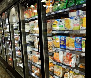frozen food grocery store isle with frozen foods in the case